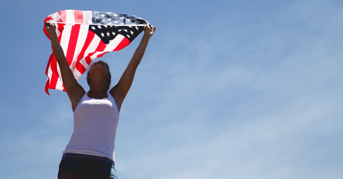 American woman getting Saudi visa in Abu Dhabi - Woman Holding Us Flag during Daytime