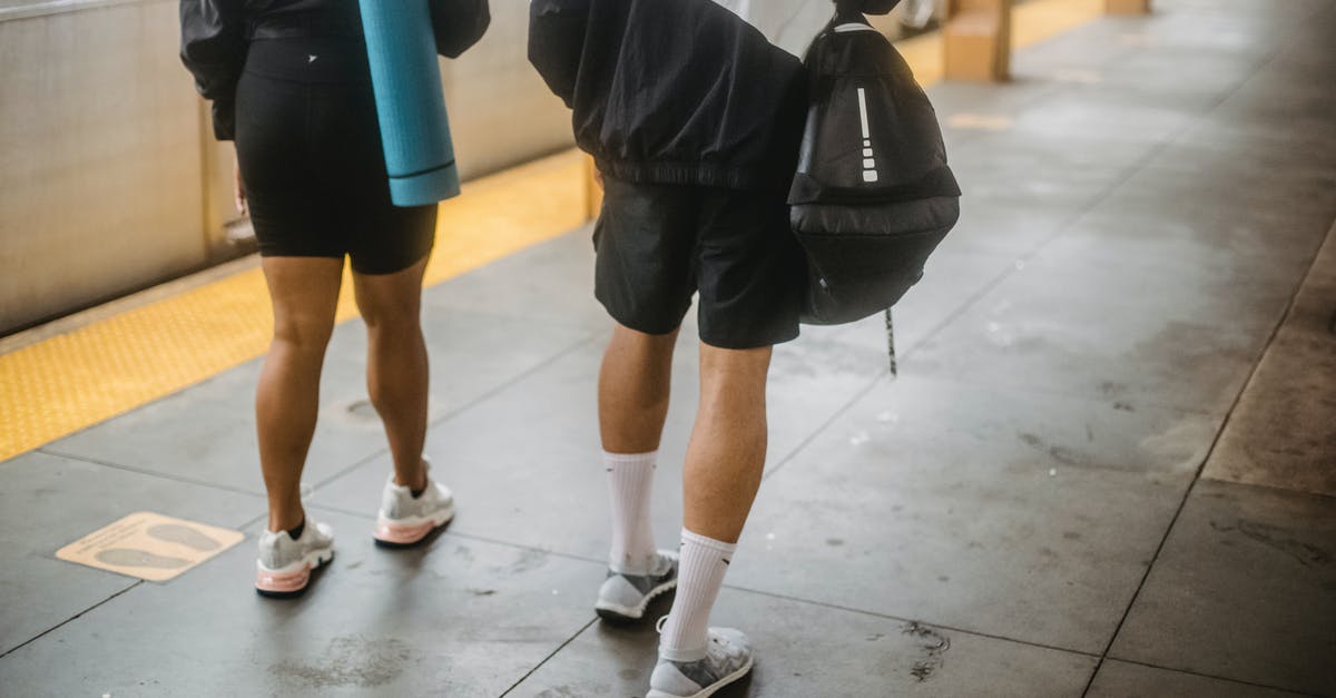 Amtrak: checking bags before the station opens - Person in Black Shorts and White Socks