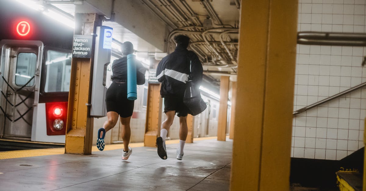 Amtrak: checking bags before the station opens - Man in Black Jacket and Blue Denim Shorts Standing on Gray Floor Tiles