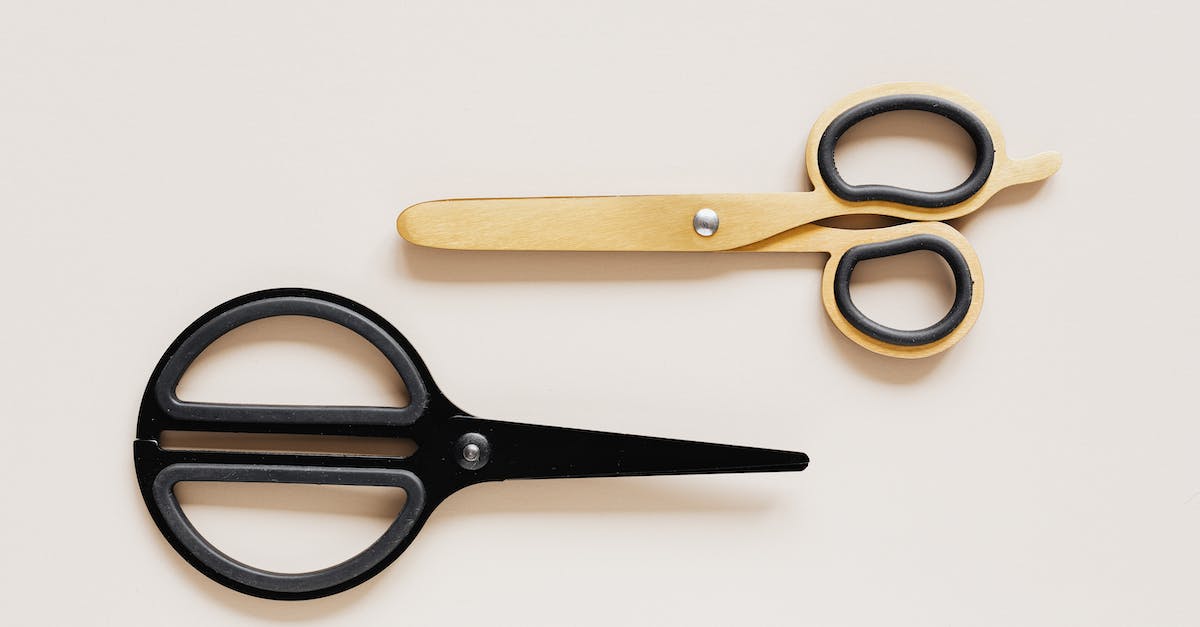 Amtrak "large sharp objects" restriction: Are small knives included? - Top view of multicolored scissors of different shape on beige table