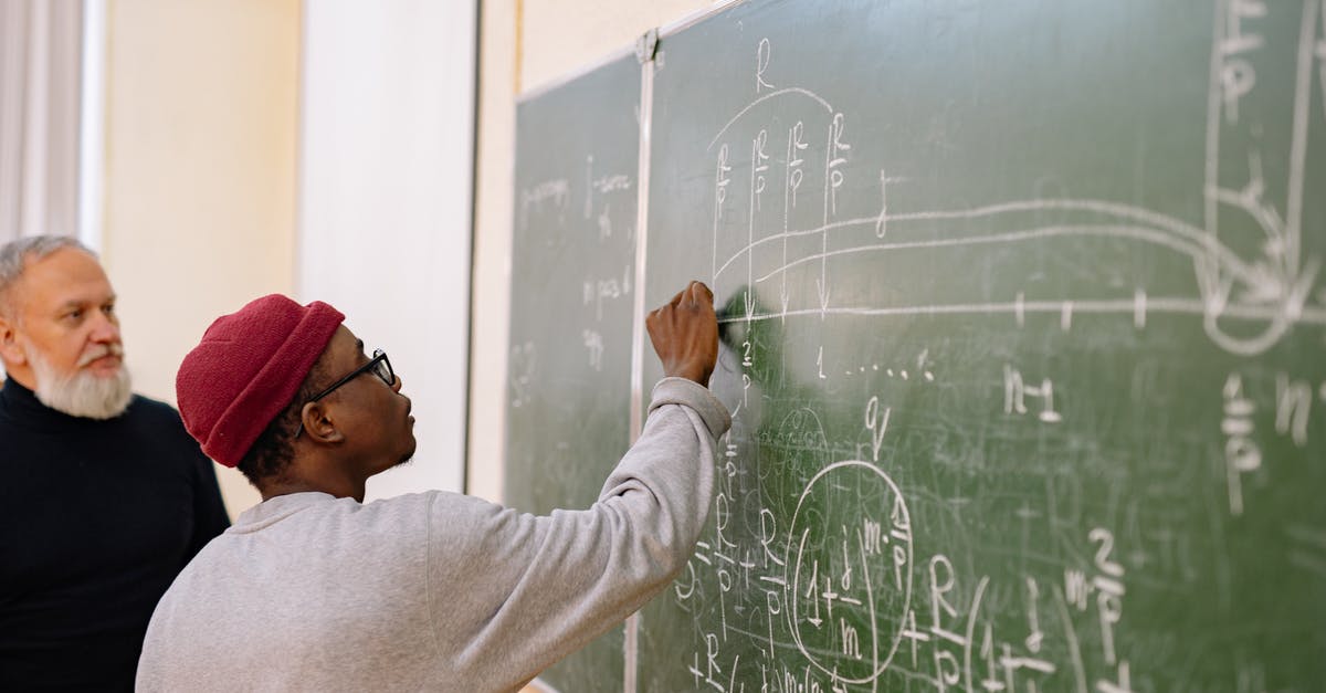 Amtrak Rail Pass questions - Man in White Long Sleeve Shirt Writing on Chalk Board