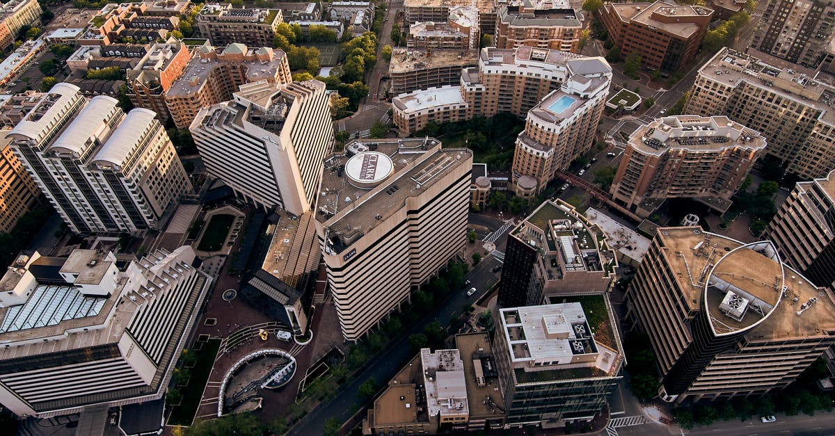 Amusement parks in the New York City area - Drone view of creative geometric buildings and green areas in residential district of modern city