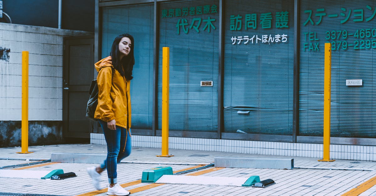 Amusement parks in the Tokyo area - Photo of Woman Wearing Yellow Jacket