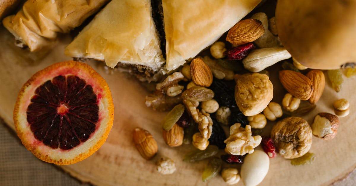 An authentic way to celebrate Novruz in Azerbaijan - Sliced Bread And Nuts on Wooden Board