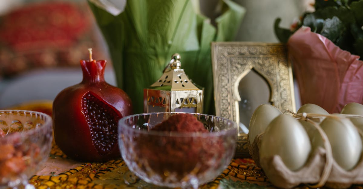 An authentic way to celebrate Novruz in Azerbaijan - Dyed Eggs And Bowl Of Red Powder On Table