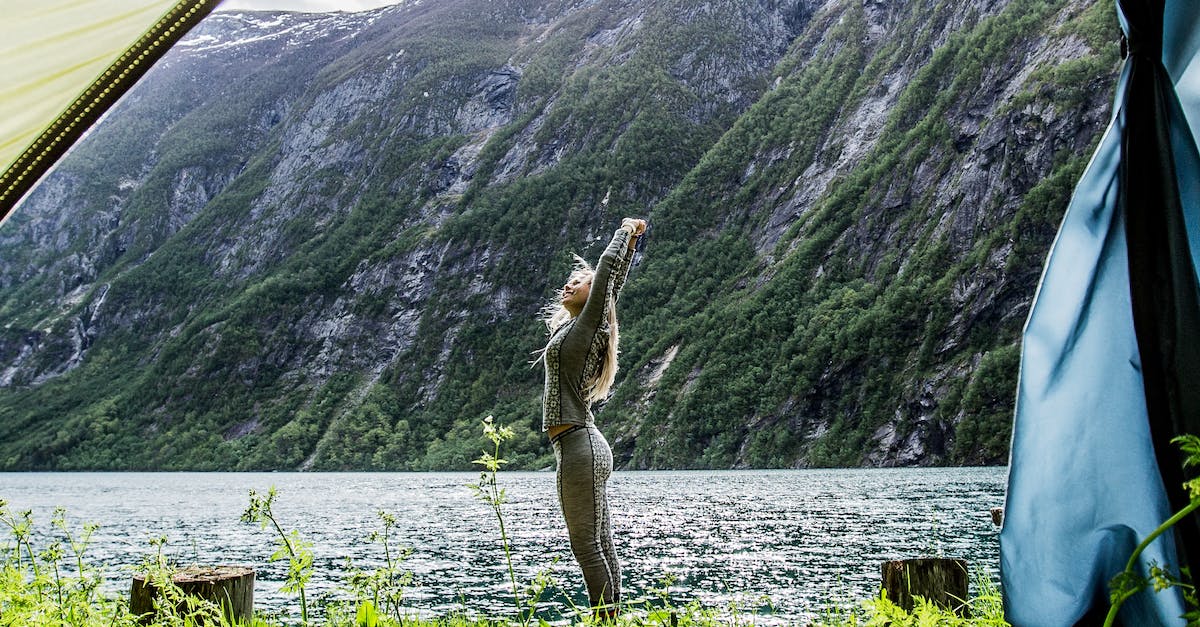 Annapurna Tilicho Lake without camping? - Woman Stretching Beside Sea