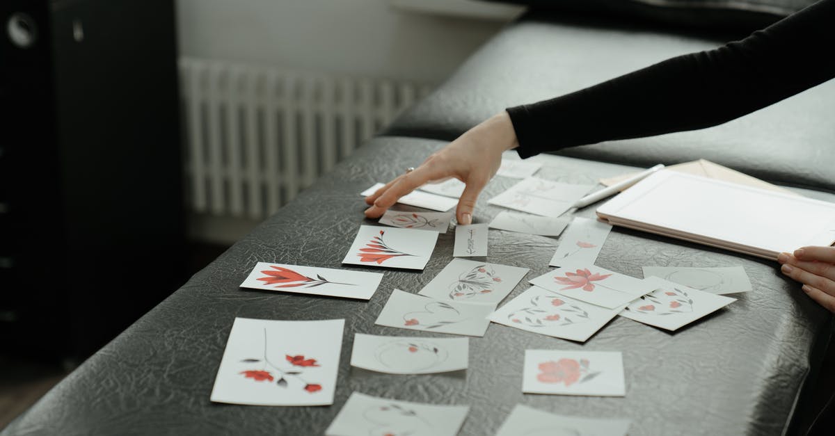 Any changes to UK Standard visa application process - Person Holding Playing Cards on Table