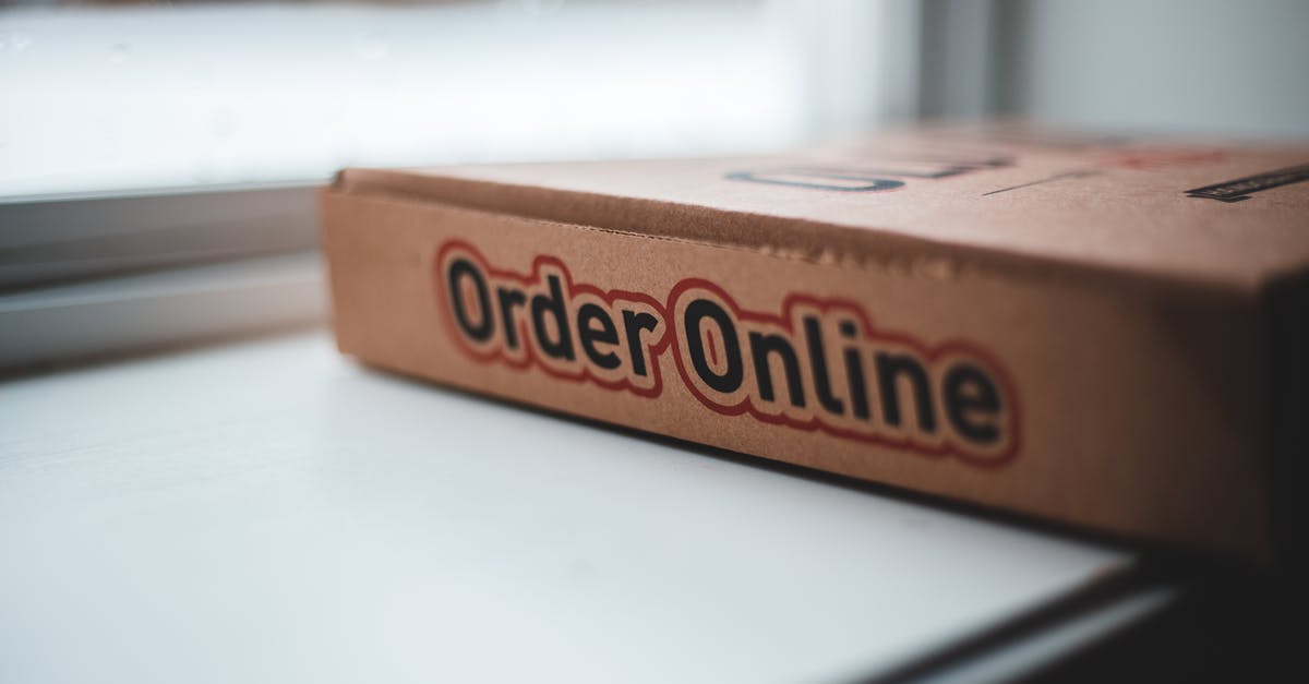 Any fast internet (good wifi) in Ubud (Bali)? - Soft focus of cardboard box of delivery pizza online service placed on white windowsill in daylight