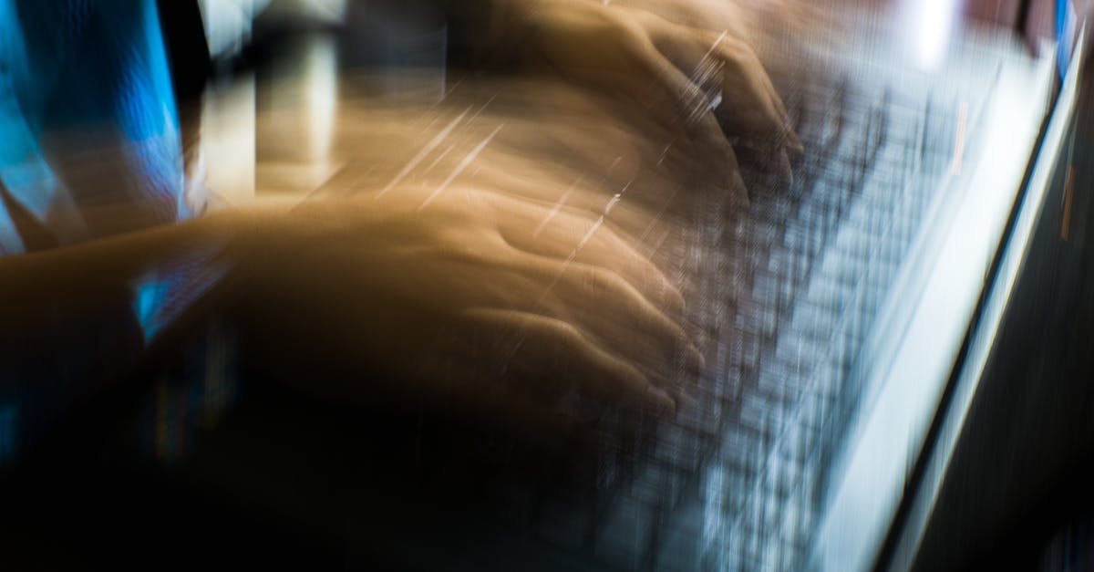 Any fast internet (good wifi) in Ubud (Bali)? - From above of crop anonymous person typing on keyboard of laptop in long exposure