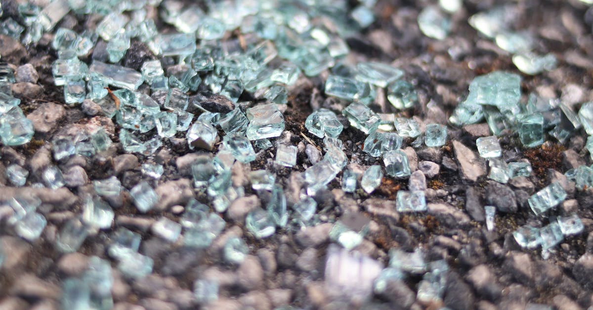 Any law forbids taking pieces of rocks out of Scotland? - Macro Shot of Pieces of Shattered Glass