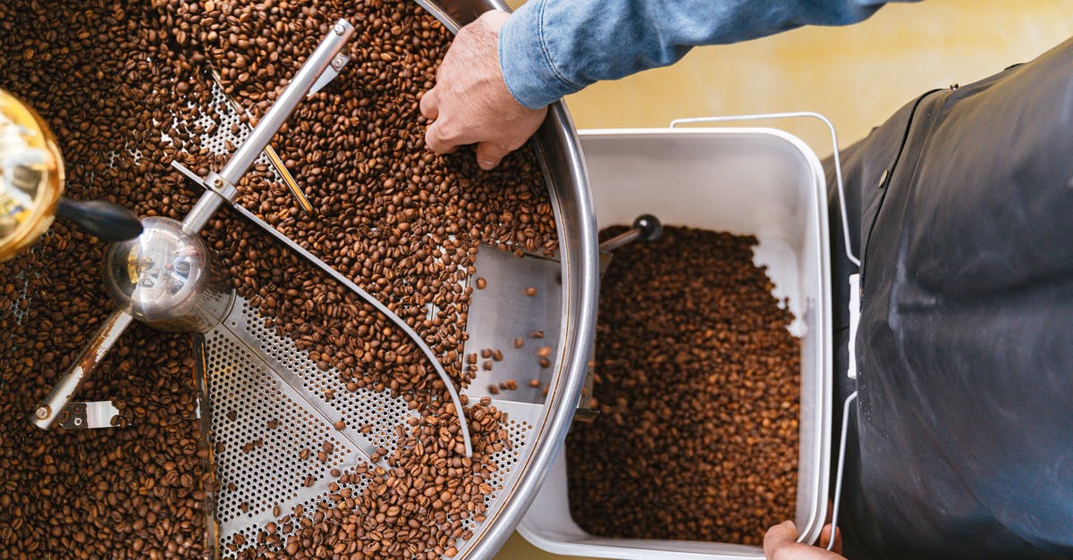 Any ride-sharing services for getting from Indiana to Texas? - A Person Holding a Bucket while Getting Coffee Beans From the Machine