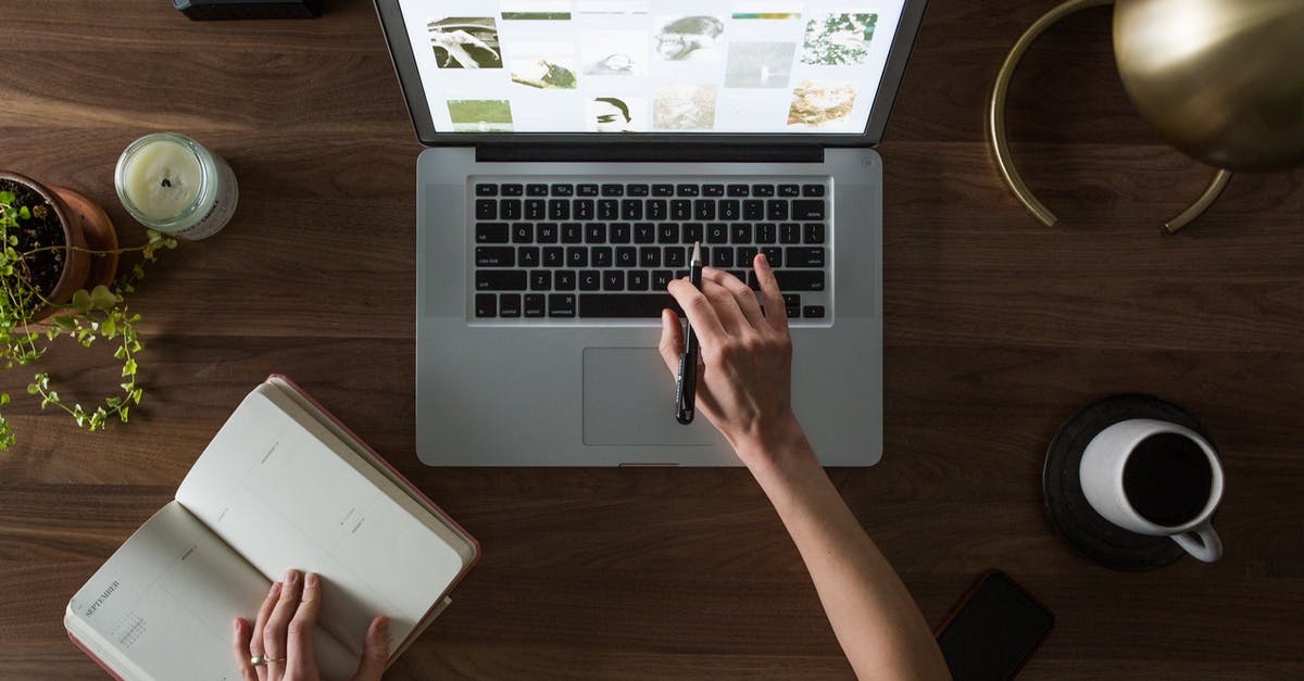 Any train planner website in the UK without giving destination? - Person Using Macbook While Holding on Planner Book