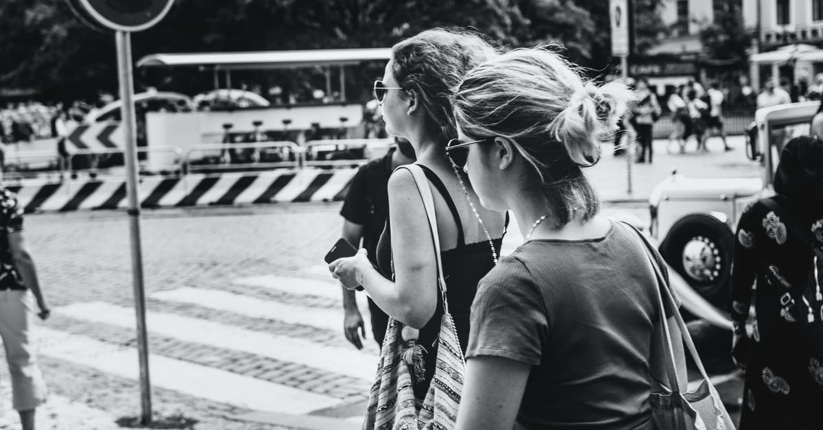 Any walking tours (in English) in Cologne or nearby? - Grayscale Photo of People Walking on The Street