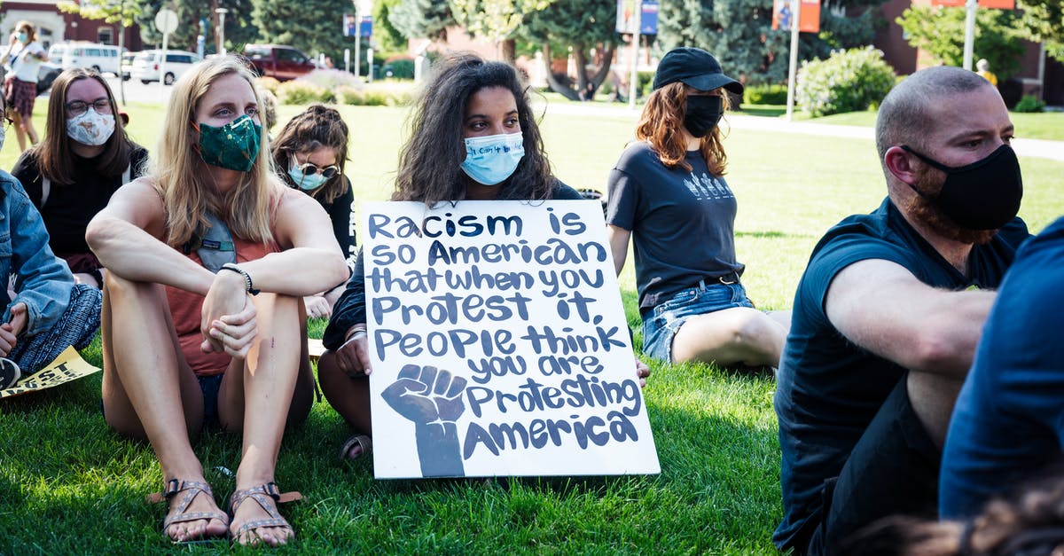 Any website that gather ongoing and upcoming strikes amongst airlines? - Young activists with banner protesting against discrimination in city park