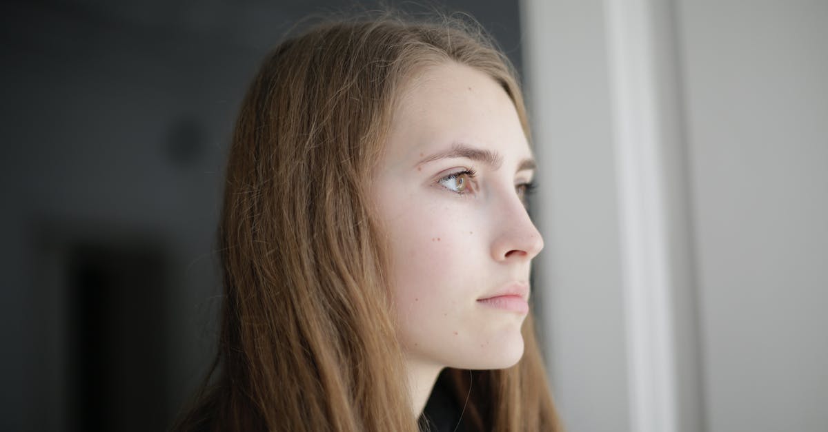 Apartment in Berlin for long stay (Two months) [duplicate] - Pensive young woman in living room