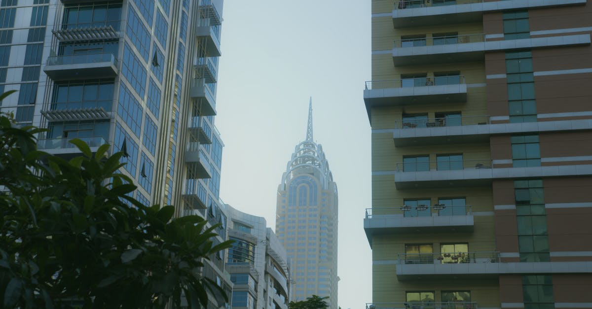 Apartment vs Hotel - Dubai downtown? - White Concrete Building