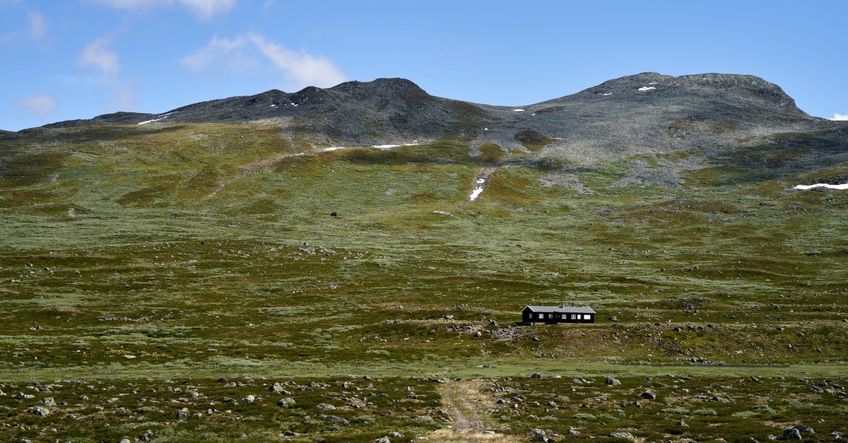 Appeal for refused visa to Norway - Black Suv on Green Grass Field Near Mountain Under Blue Sky