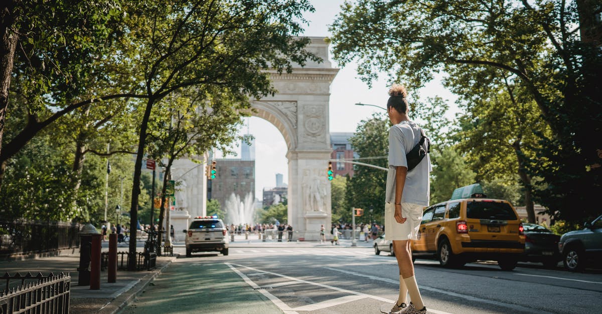 Applied for US B2 visa and don't want to continue - Unrecognizable sporty guy riding skateboard on city street in daylight