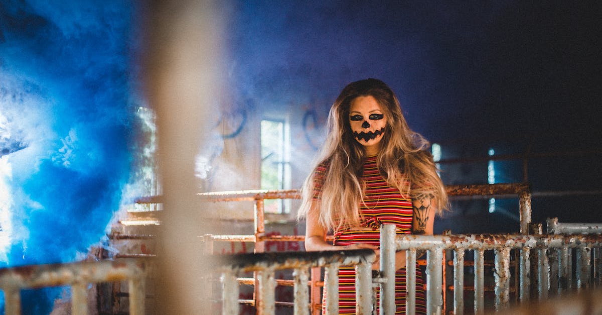 Apply for India visa but not effective immediately - Woman with scary makeup standing near metal fence