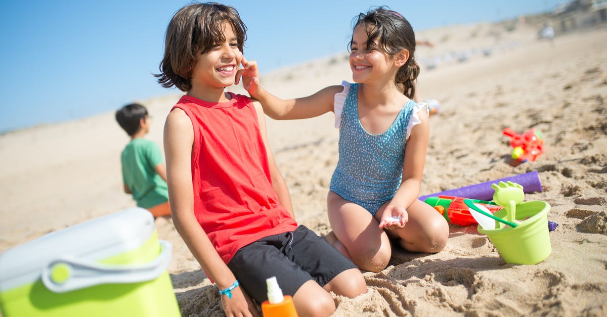 Applying for a B2 visa after previous overstay as a child? - Young Girl Putting Sunscreen on a Boy
