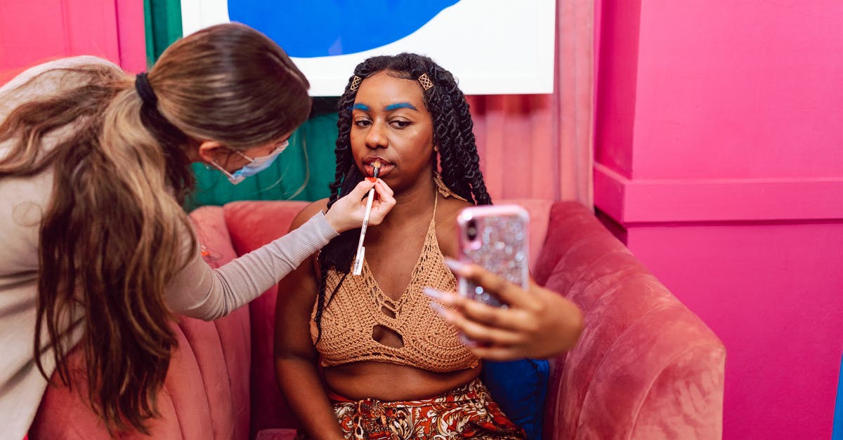 Applying for a B2 while on J1 in the US - Woman Taking a Selfie while Getting Her Makeup Done