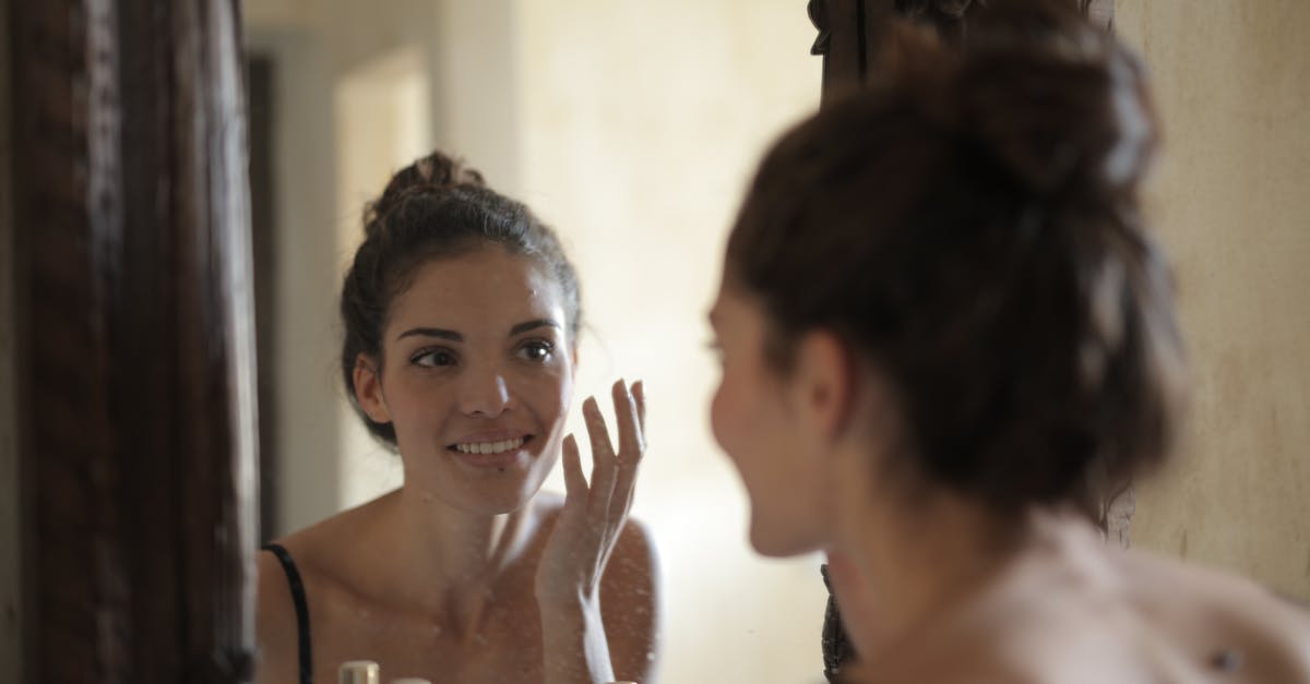 Applying for a Schengen visa using spouse's bank statement - Reflection Photo of Woman Smiling