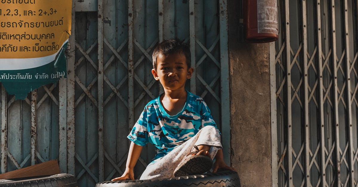 Applying for a Thailand visa, but I don’t have a guarantor yet - Child Sitting on Tires Applying for a Thailand visa, but I don’t have a guarantor yet - Child Sitting on Tires