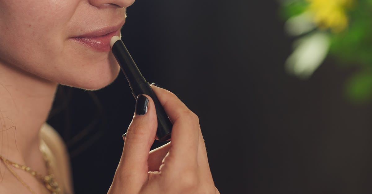Applying for a visa if I am not sure to use it [closed] - Close-up of a Woman Applying Lipstick