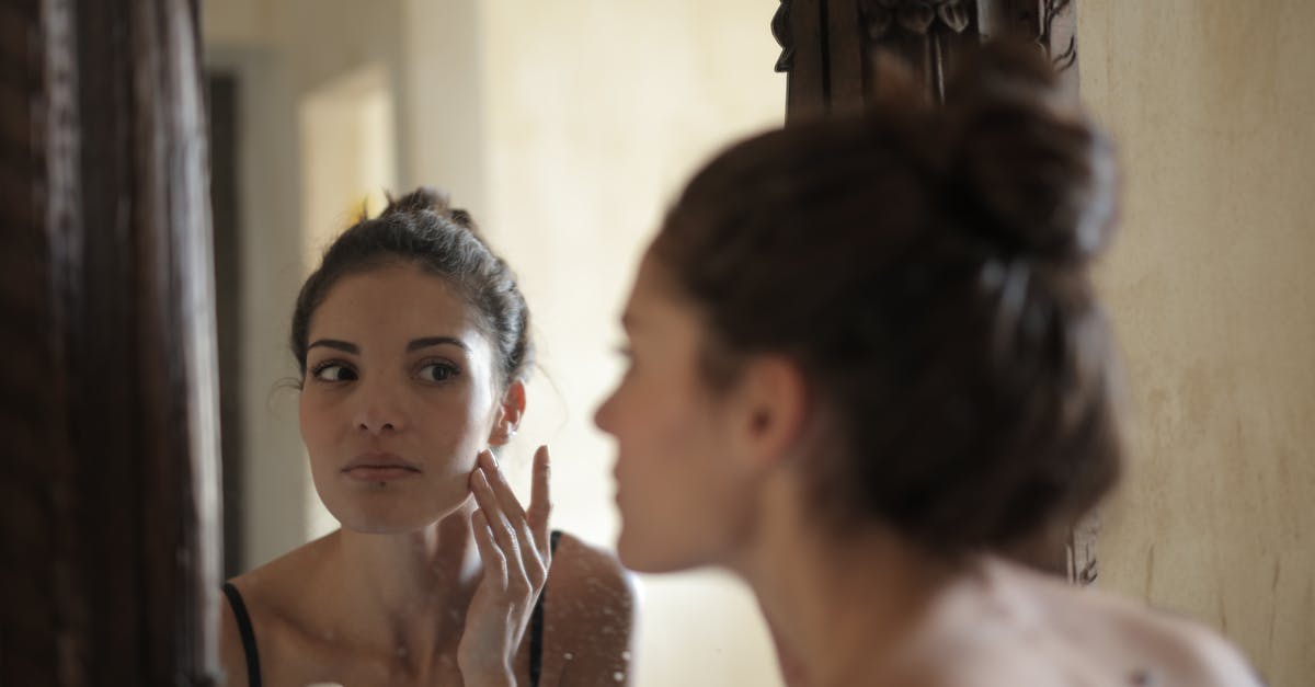 Applying for an ESTA but then not using it: problem? - Reflection Photo of Woman Touching Her Cheek