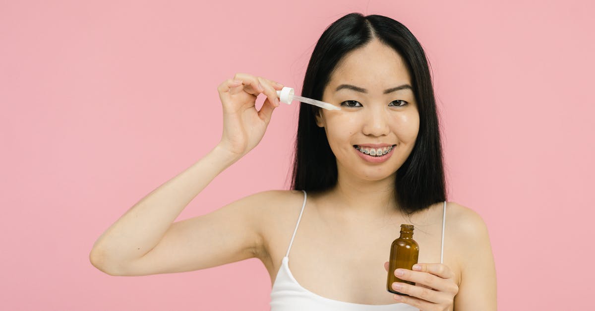 Applying for B1/B2 while under the ESTA visa in USA - Woman in tank top applying cosmetic product under her eye