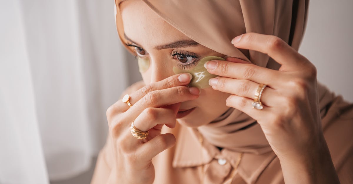 Applying for B1/B2 while under the ESTA visa in USA - Woman in Brown Hijab Covering Her Face With Her Hand