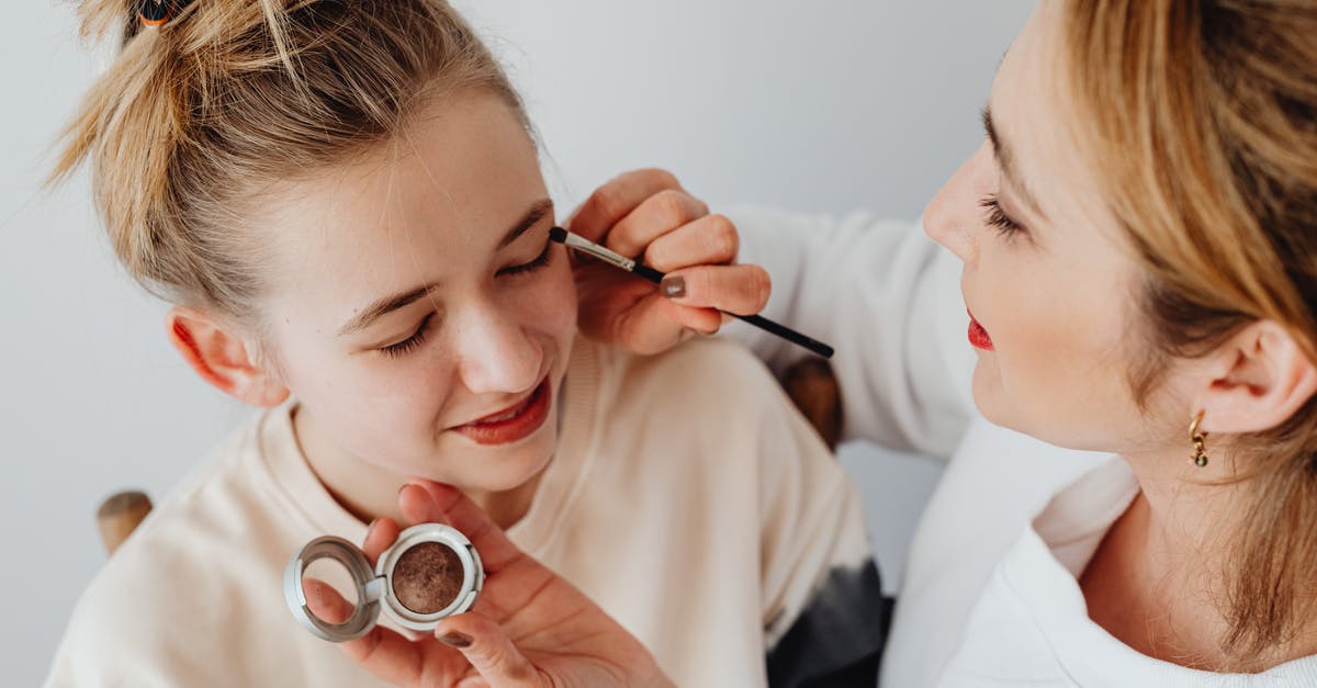 Applying for EEA Family Permit strictly 3 months in advance? - Photograph of a Woman Applying Makeup on a Girl