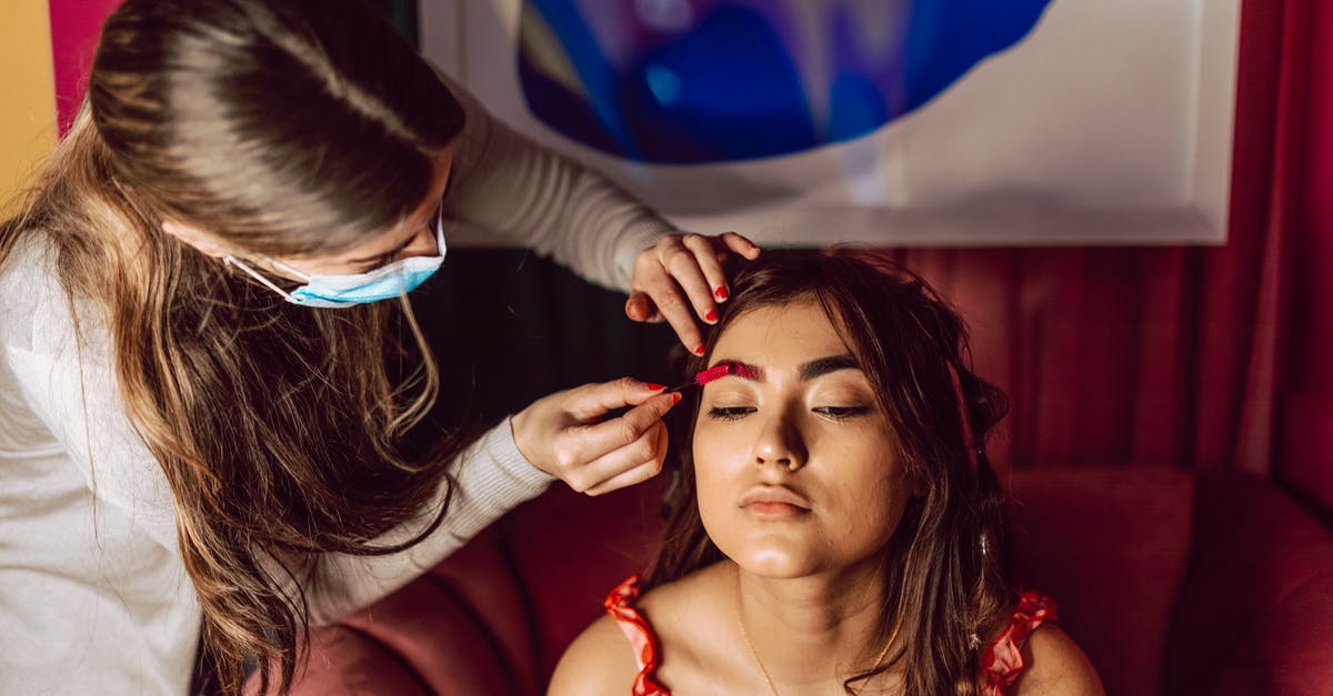 Applying for German Schengen visa for several years' duration - A Woman with Brown Hair Getting Her Makeup Done