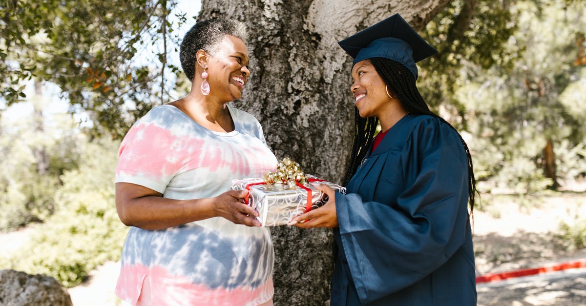 Applying for UK Visitor visa for daughter's graduation - A Woman Giving a Graduation Gift to her Daughter