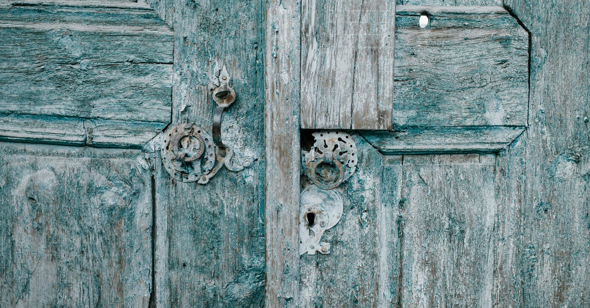 Applying for visa after entry refusal (full time student) [duplicate] - Shabby wooden blue doors with rusted locks