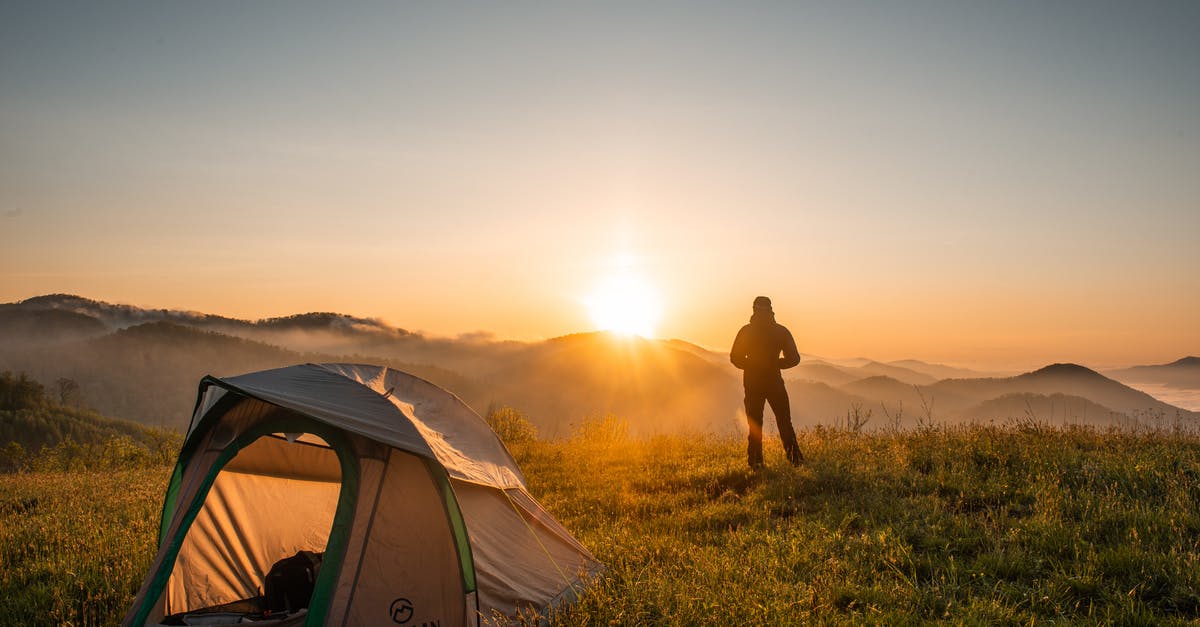 April Hokkaido Camping and Hiking [closed] - Silhouette of Person Standing Near Camping Tent