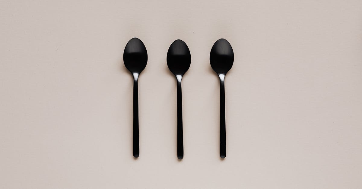 Are Adaouste and Audoste in Provence the same place? - Set of black teaspoons on beige surface