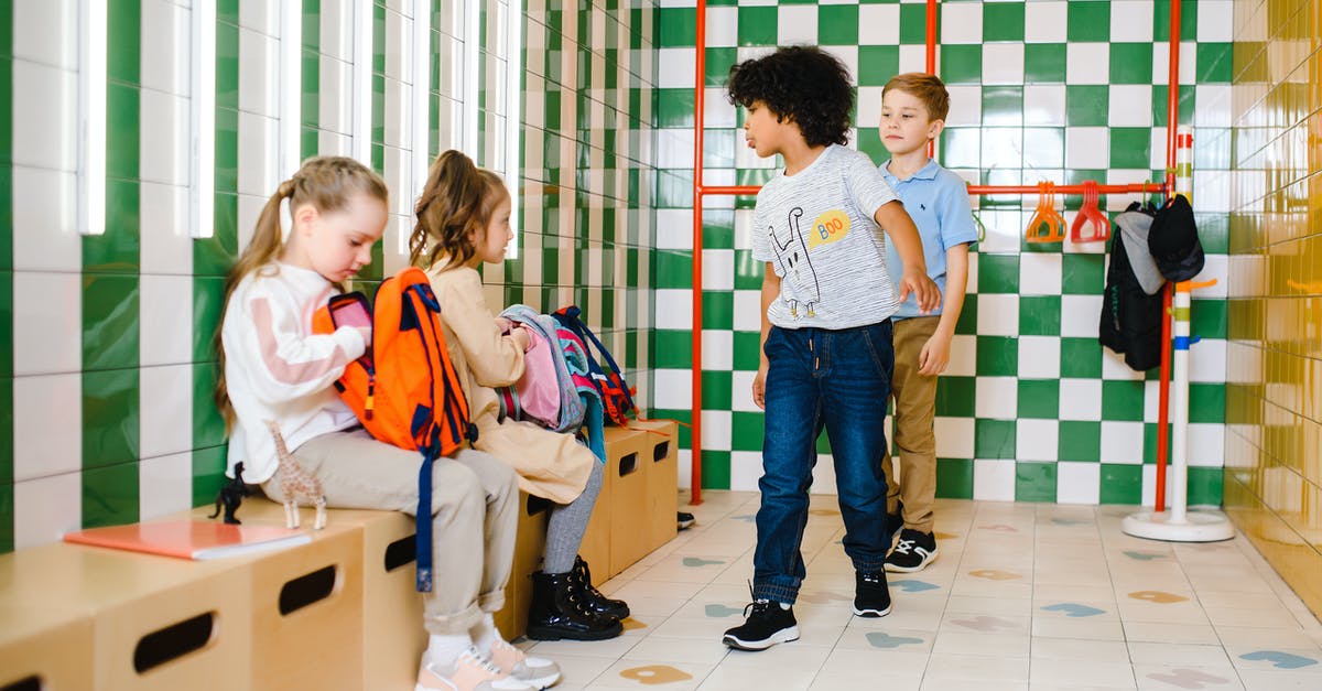 Are backpacks allowed on Eurolines buses? - 2 Boys and Girl Standing on White Floor Tiles