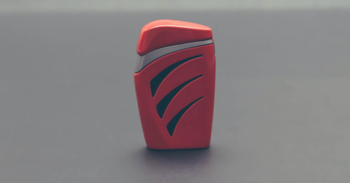 Are cigarette lighters allowed in airports? [closed] - Close-up of Red Object over White Background