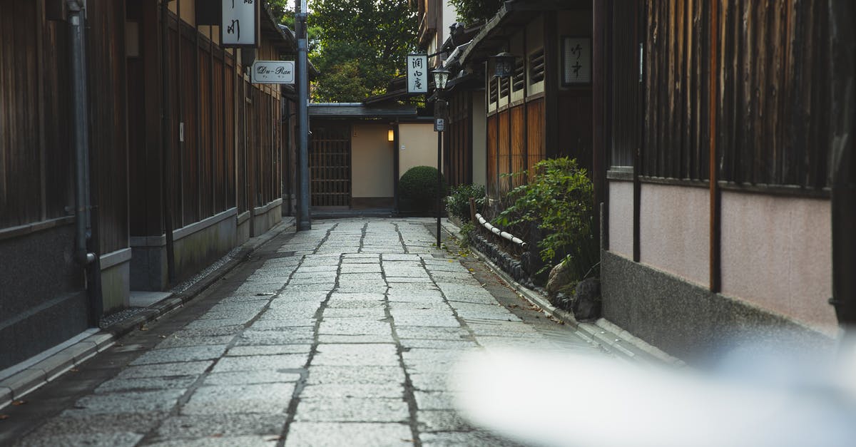 Are inexpensive ryokans inauthentic? - Empty paved street in historic town in Japan