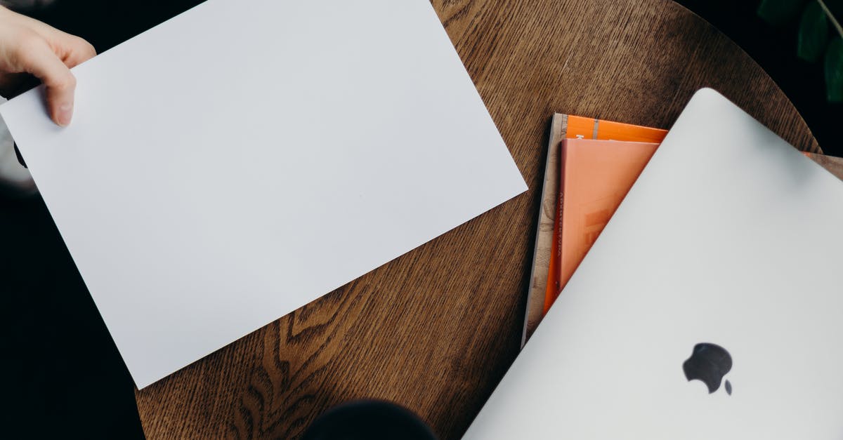 Are left pages of passports ever used? - White Printer Paper on Brown Wooden Table