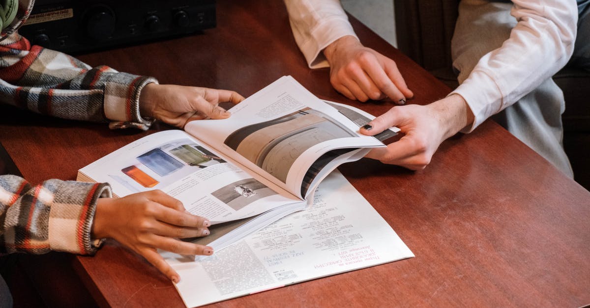 Are left pages of passports ever used? - Free stock photo of administration, adult, at table