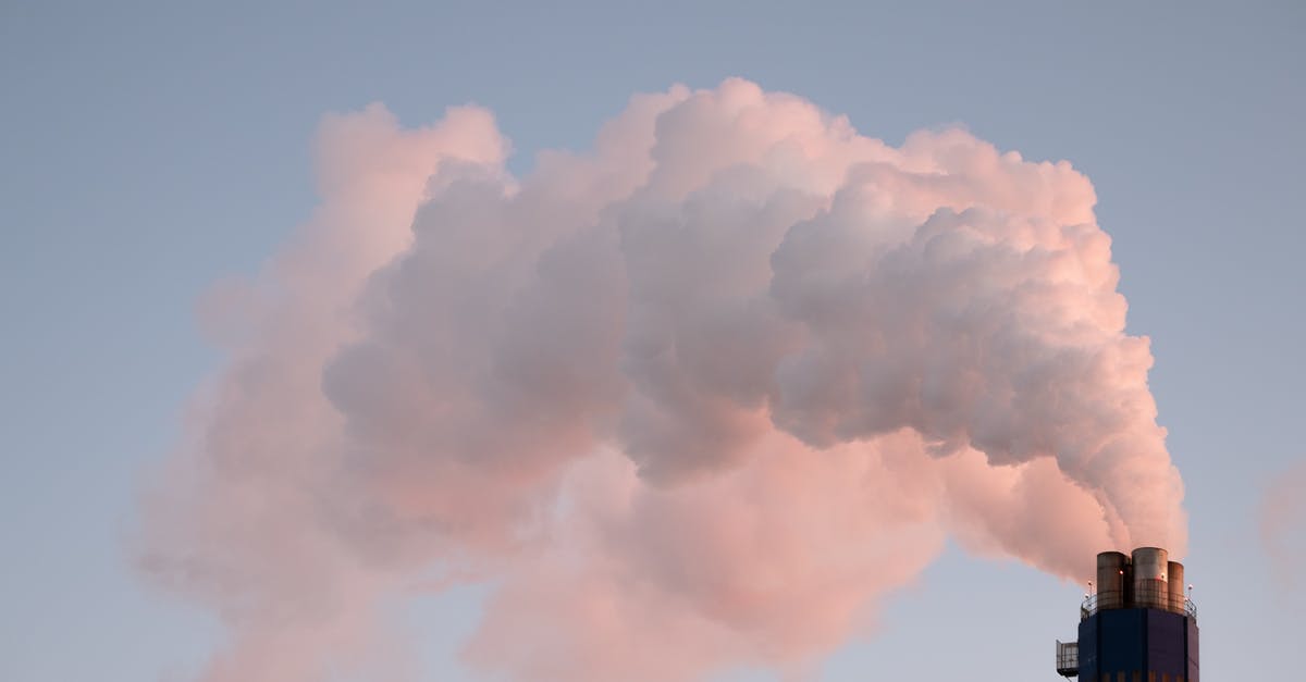 Are magnets still a problem as luggage on air travel? - From below of clouds of smoke from industrial factory pipes polluting atmosphere against cloudless sky