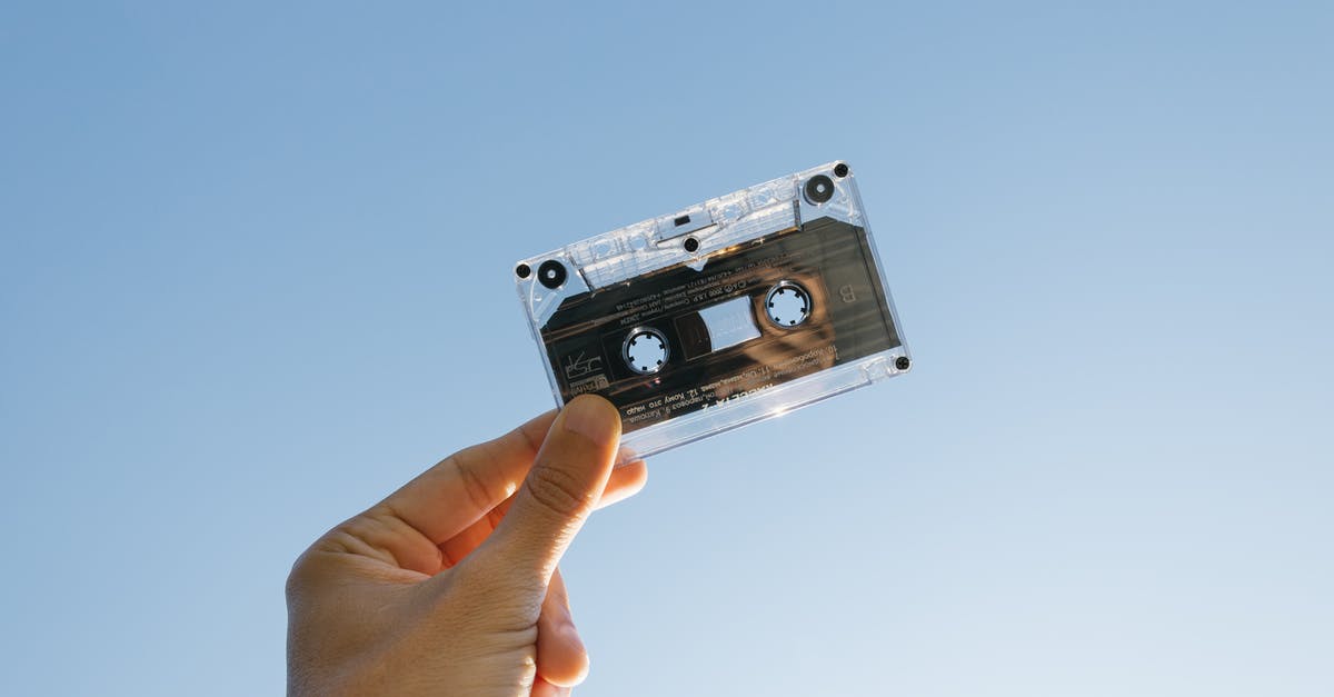 Are personal electronics not allowed in outlets on Cathay Pacific? - Person Holding Cassette