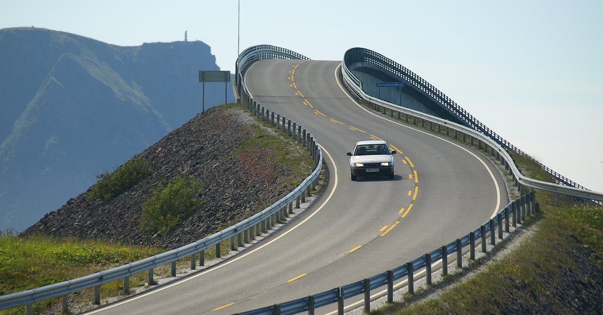 Are the roads in Norway in good condition? - White Car On The Road 