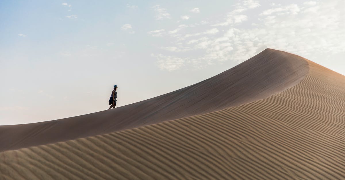 Are the sand dunes at Knolls, UT safe to visit? - Person Walking on Desert
