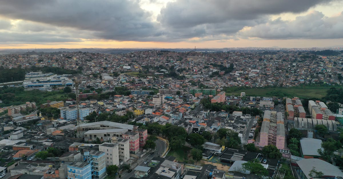 Are there air traffic routes that are turbulence-sensitive? - Cityscape of modern green district at sundown