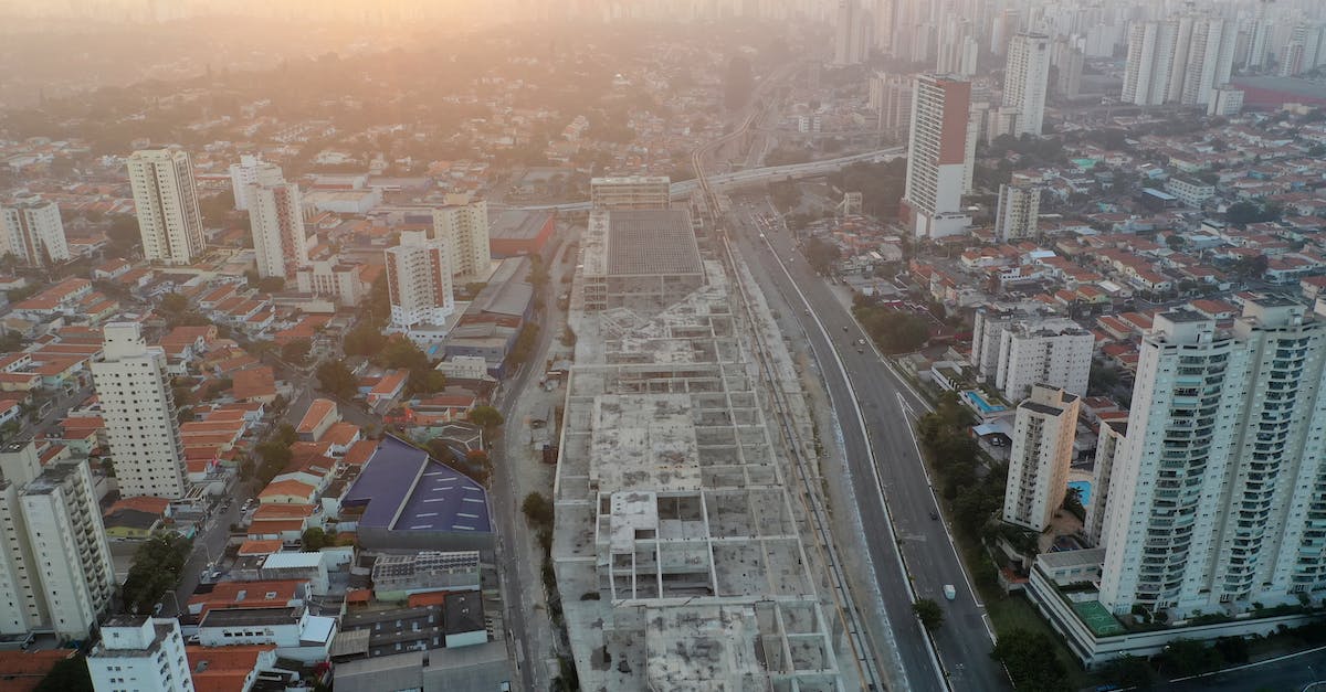 Are there air traffic routes that are turbulence-sensitive? - Modern city district with skyscrapers at sunset