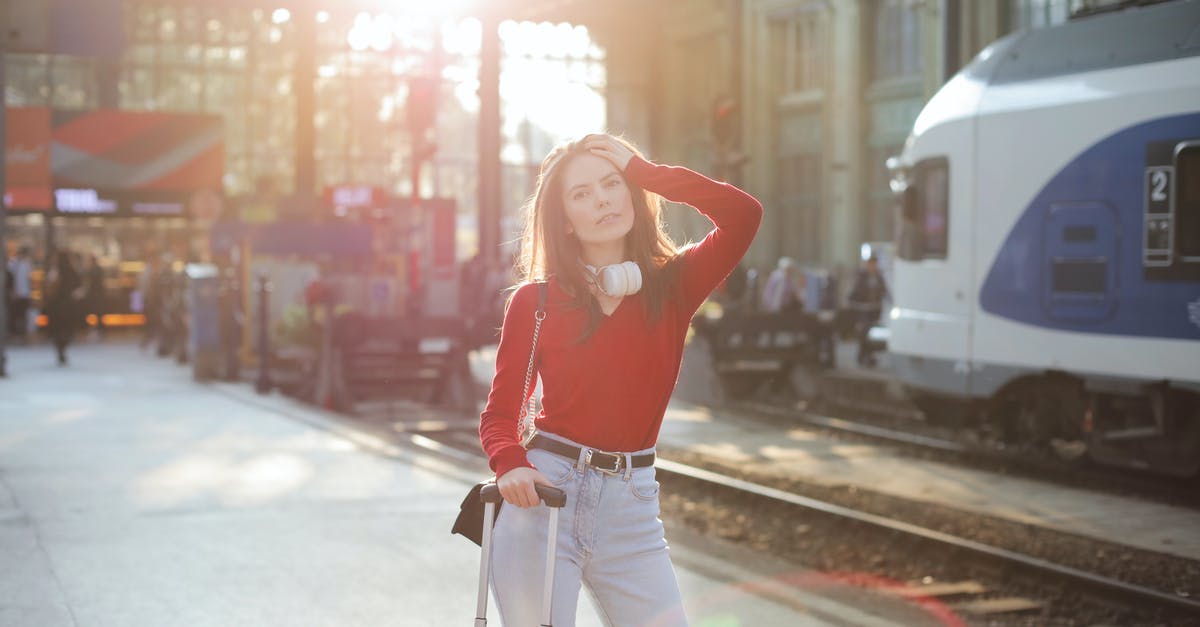 Are there any baggage lockers at Amsterdam Zuid Station? - Serious woman posing at railroad station