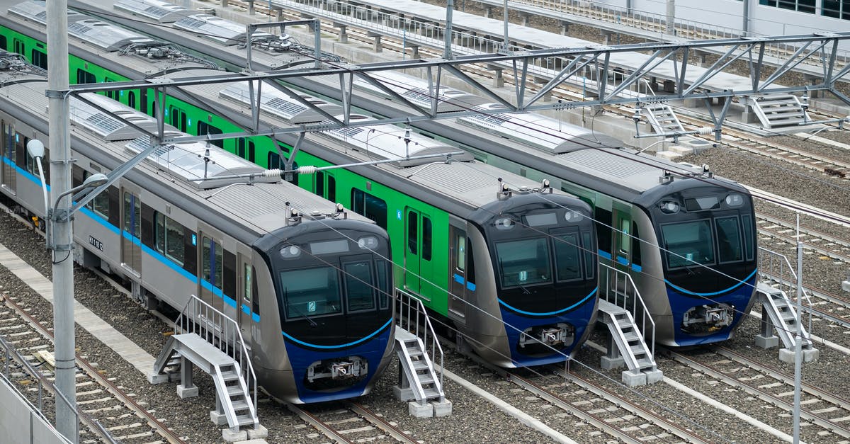 Are there any binational mass rapid transit systems? - Blue and White Train in Train Station